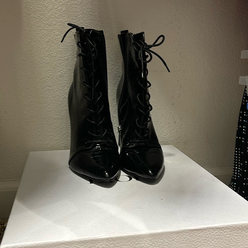 Charles Davis black crocodile booties.